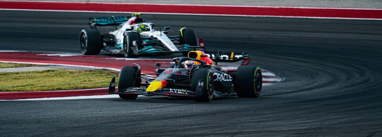Competition between racing cars of Lewis Hamilton and Max Verstappen on the track at COTA USGP 2022