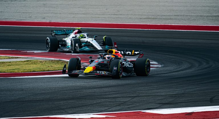 Competition between racing cars of Lewis Hamilton and Max Verstappen on the track at COTA USGP 2022
