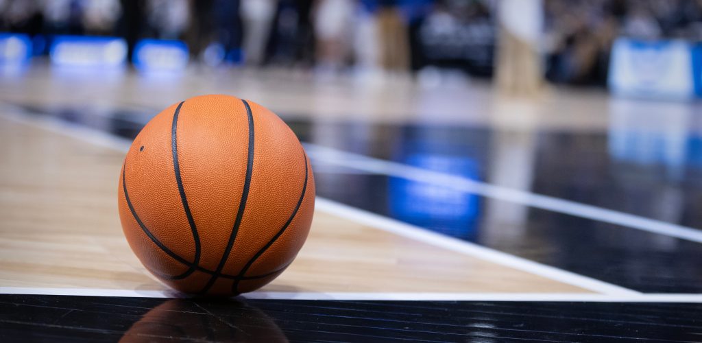 Basketball resting on a court during a big championship game. Copy space and great basketball concept photo