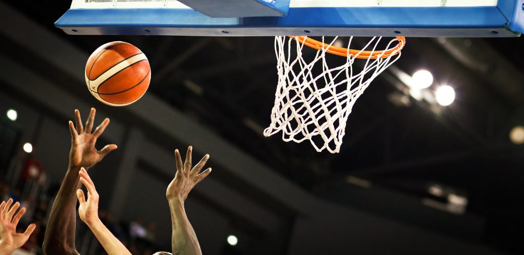 scoring during a basketball game - ball in hoop